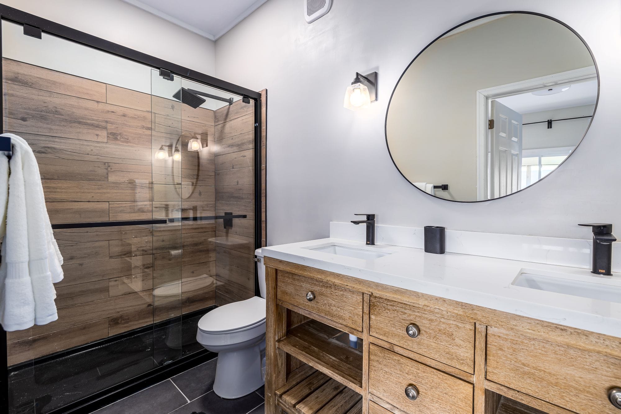 Second full bath with a double vanity and a glass walk-in shower