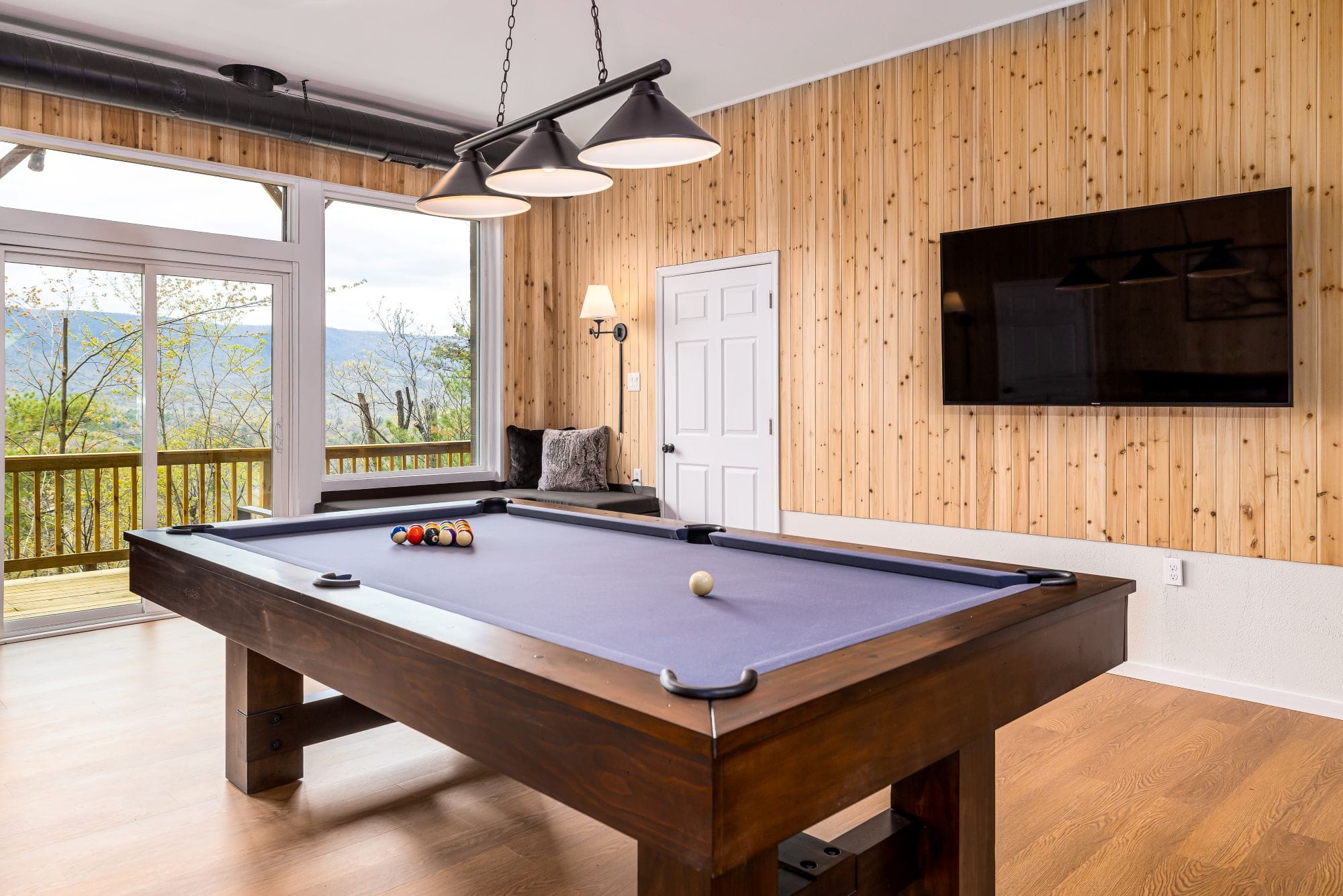 Lower-level game room with a pool table