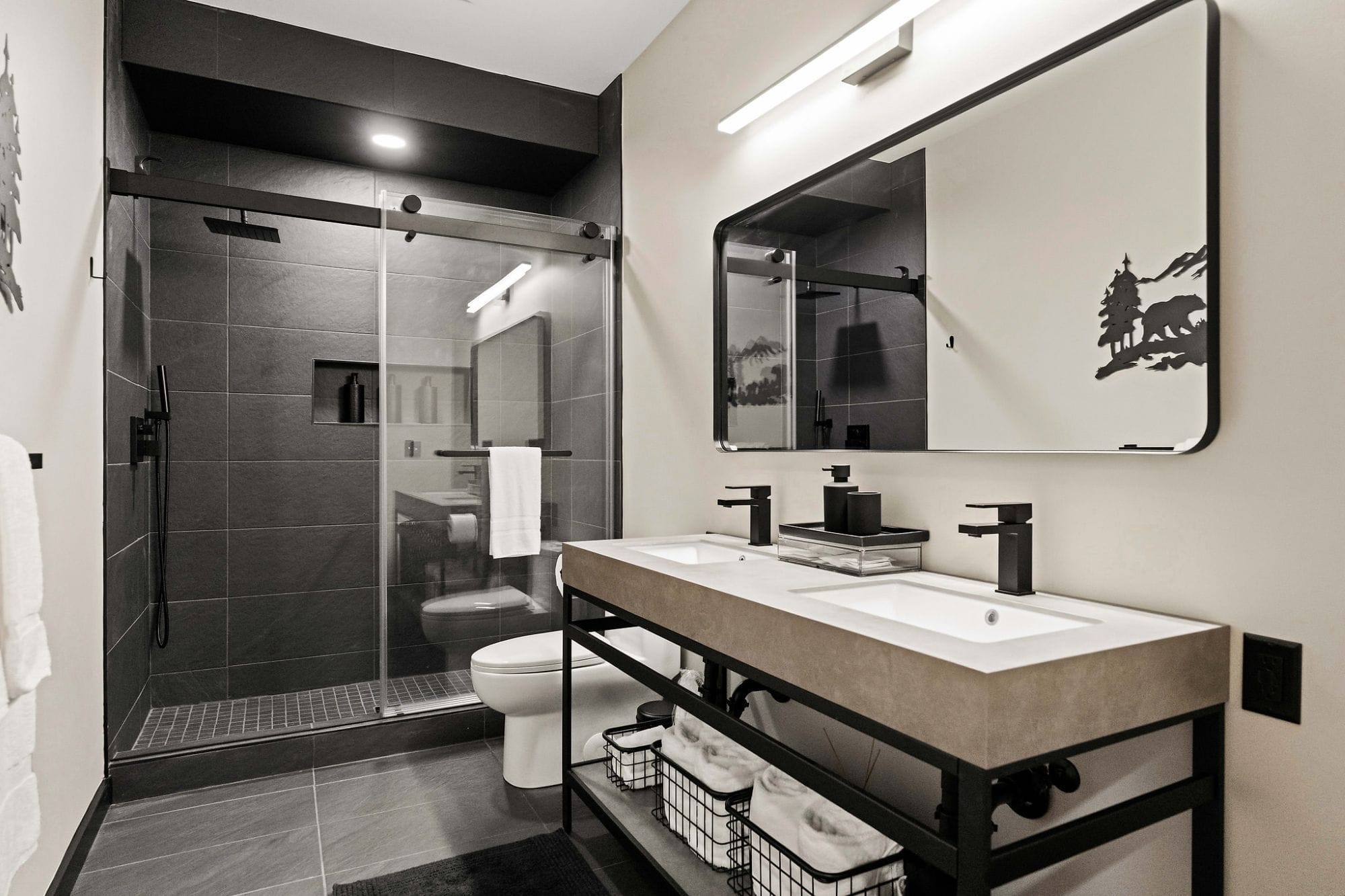 Bathroom with a double vanity and a sliding-glass walk-in shower