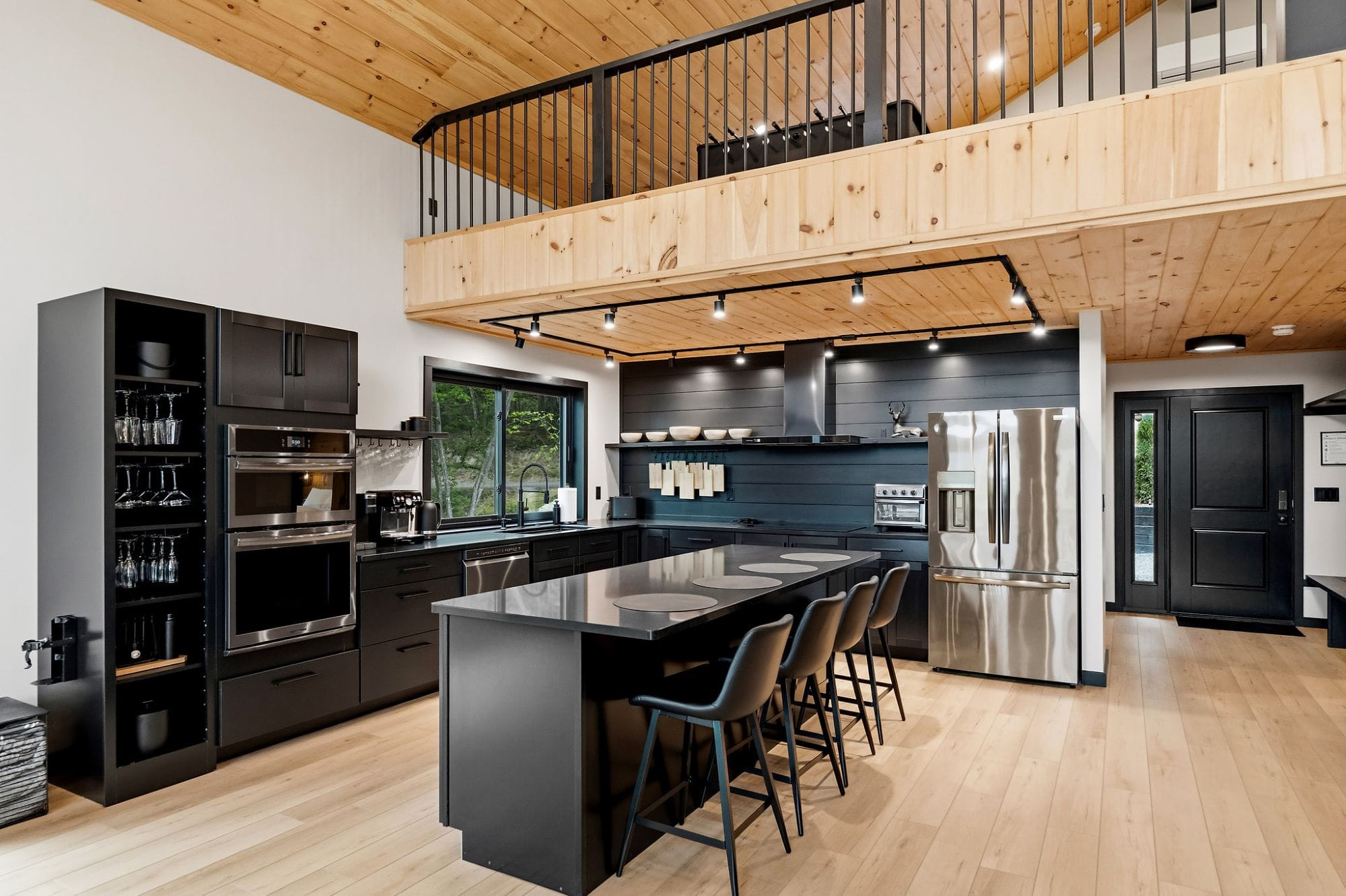 Chef's kitchen with a loft above