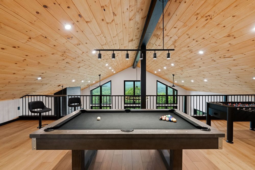 Loft game room with pool table and foosball